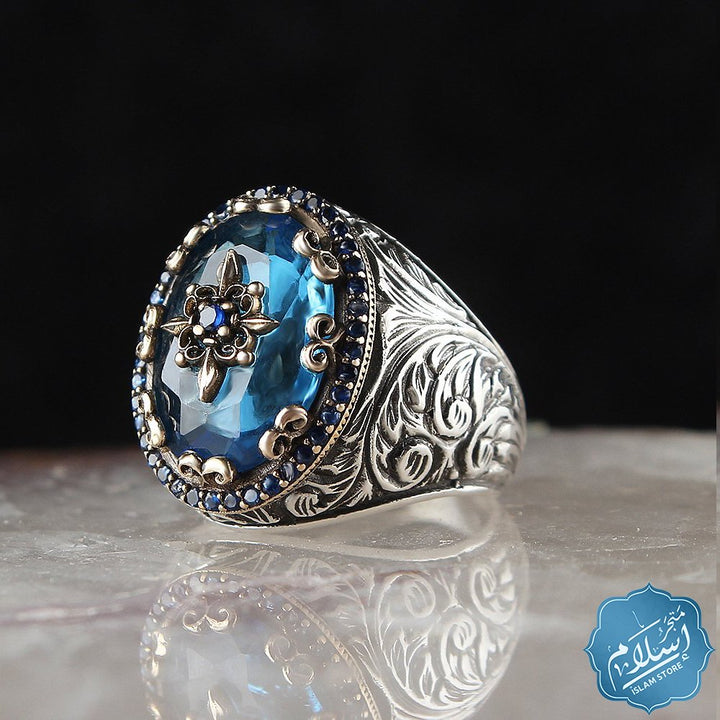 Silver ring with blue topaz stone