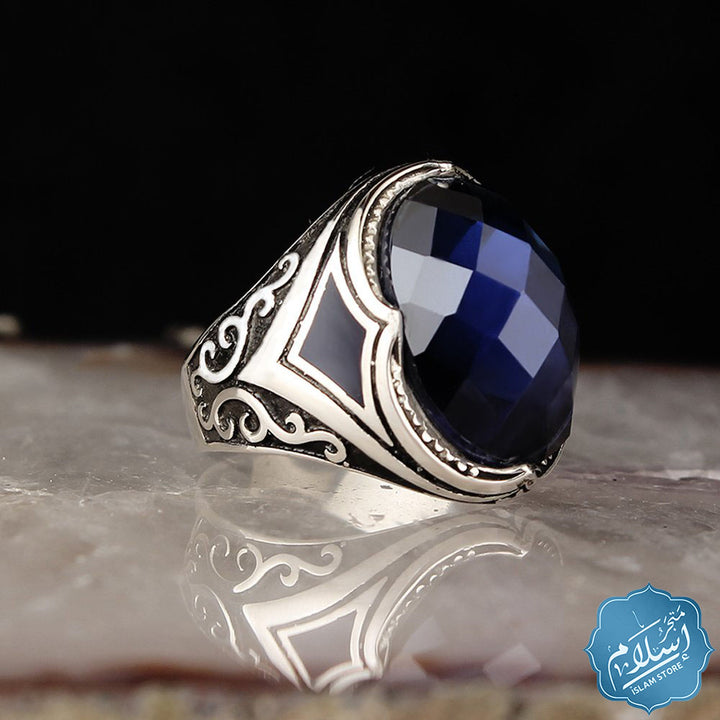 Silver ring with blue zircon stone