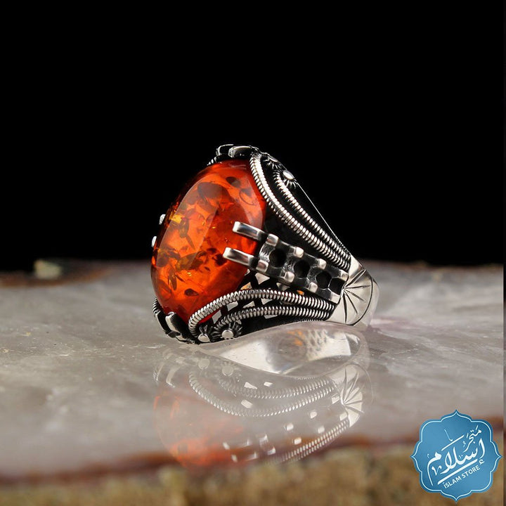 Silver ring with orange amber synthetic