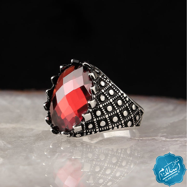 Silver ring with red zircon stone