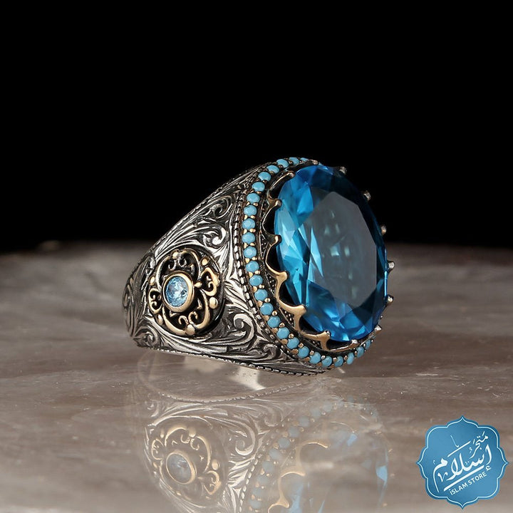 Silver ring with blue topaz stone